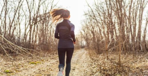 woman running on trail