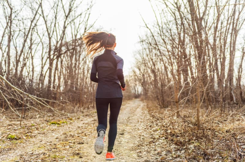 woman running on trail